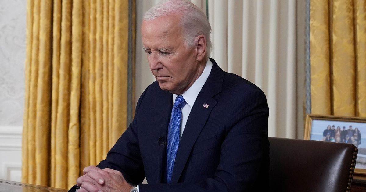 President Joe Biden pauses before addressing the nation from the Oval Office of the White House in Washington, D.C., on July 24.