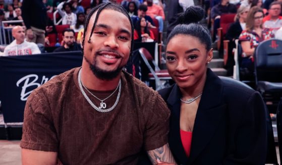 Jonathan Owens, left, and Simone Biles, right, attend a game between the Houston Rockets and the Los Angeles Lakers in Houston, Texas, on Jan. 29.