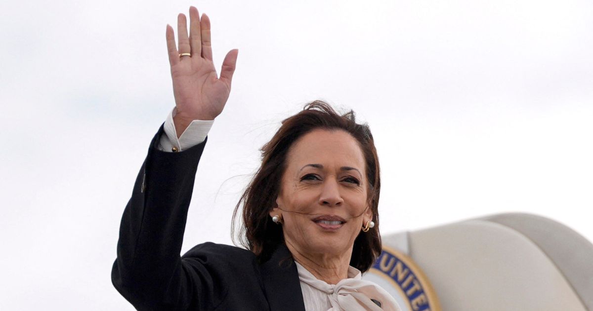 Vice President Kamala Harris waves as she boards Air Force Two at San Francisco International Airport in San Francisco, California, on Sunday.