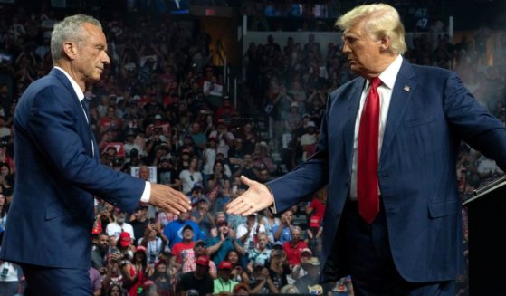 Former independent presidential candidate Robert Kennedy Jr., left, joins former President Donald Trump, right, during a campaign rally in Glendale, Arizona, on Friday.