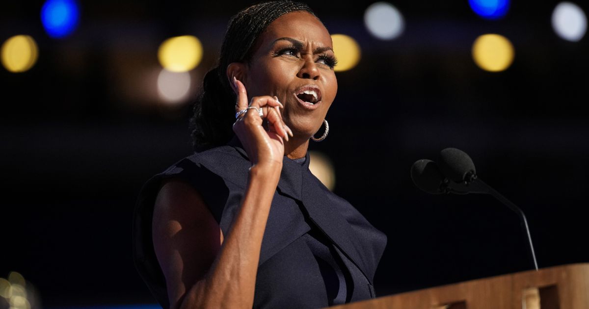 Former first lady Michelle Obama speaks on stage during the second day of the Democratic National Convention at the United Center in Chicago, Illinois, on Tuesday.