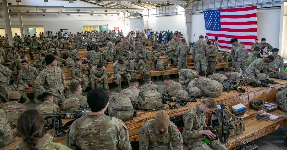 Soldiers of the 82nd Airborne Division wait to be deployed to Europe at Fort Bragg, North Carolina, on Feb. 14, 2021.