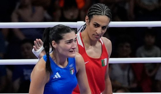 Algeria's Imane Khelif, in red, acknowledges Italy's Angela Carini at the end of their women's preliminary boxing match at the 2024 Summer Olympics, Thursday in Paris.