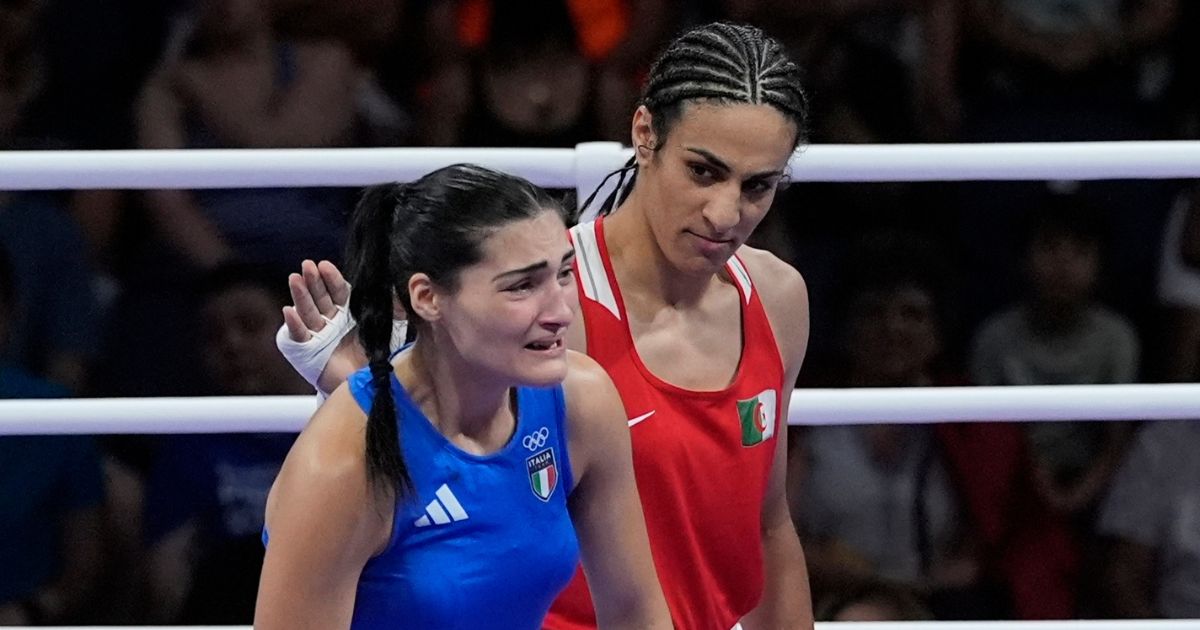 Algeria's Imane Khelif, in red, acknowledges Italy's Angela Carini at the end of their women's preliminary boxing match at the 2024 Summer Olympics, Thursday in Paris.