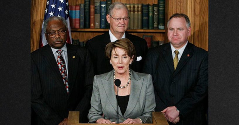 Democrat House Speaker Nancy Pelosi, center, thanked then-Minnesota Rep.Tim Walz, right, for his service on the battlefield during a news conference on Capitol Hill in February of 2007 in Washington, D.C.