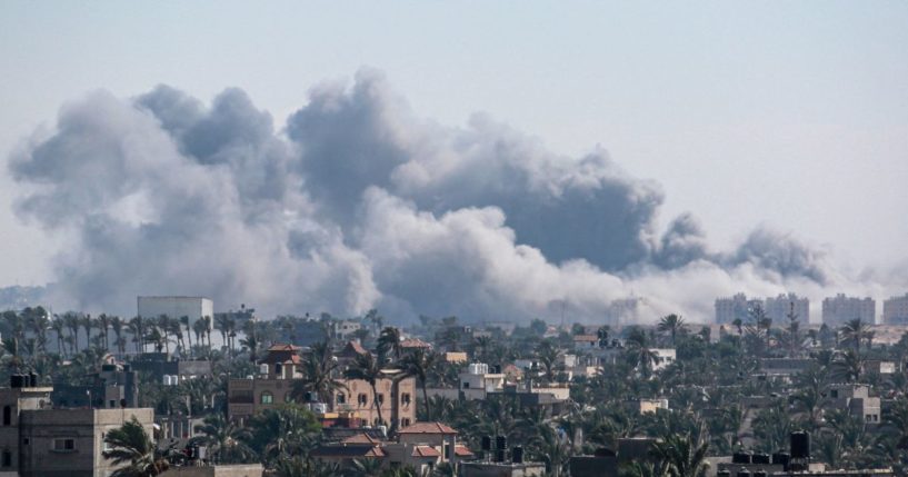 A picture taken from Deir el-Balah shows smoke billowing after an Israeli strike on Khan Yunis.