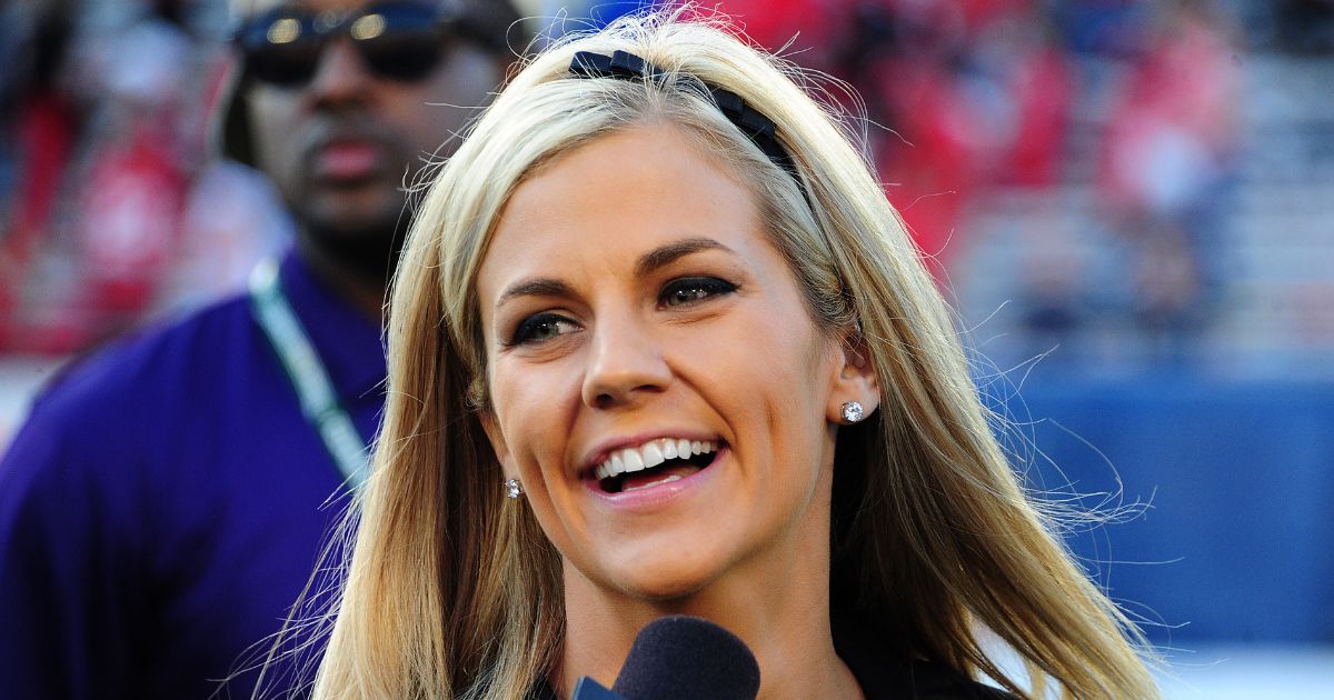 Samantha Ponder gets set to do postgame interviews after the Capital One Bowl between the Georgia Bulldogs and the Nebraska Cornhuskers at the Citrus Bowl on January 1, 2013 in Orlando, Florida.