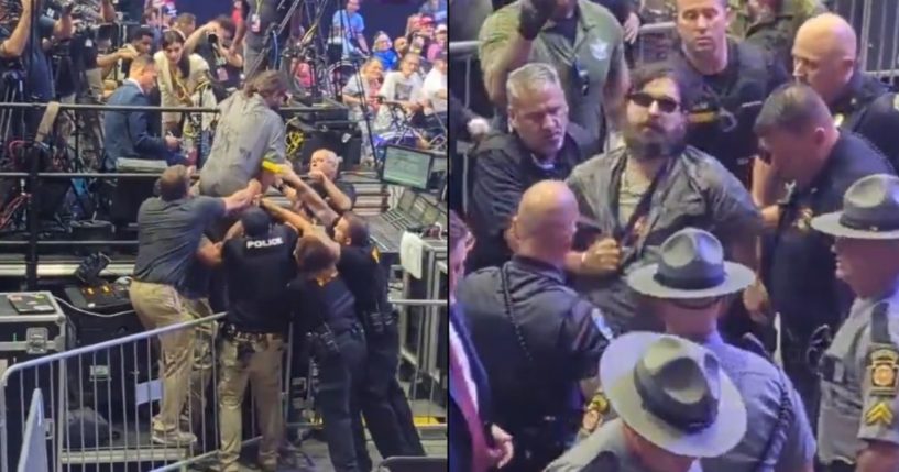 An unidentified man at a Trump rally is tackled by security after trying to breach a secured area.