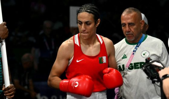 Algeria's Imane Khelif (C) arrives for her women's 66kg preliminaries round of 16 boxing match against Italy's Angela Carini during the Paris 2024 Olympic Games.