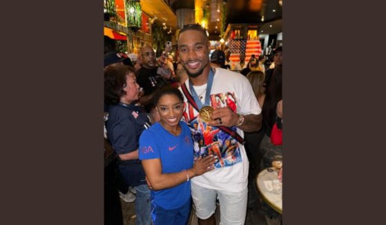 Simone Biles and husband Jonathan Owens in a photo that sparked controversy during the Olympics.