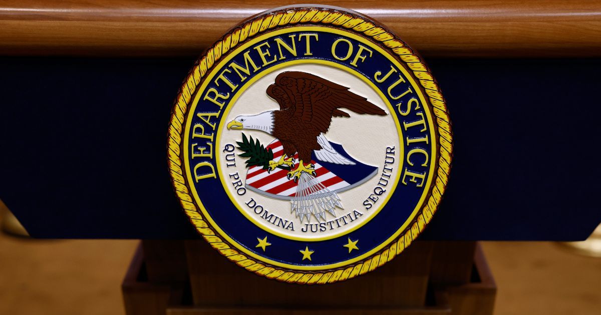 A seal for the Department of Justice is seen on a podium ahead of a news conference with U.S. Attorney General Merrick Garland at the Department of Justice Building on March 21, 2024 in Washington, DC. During the news conference, Garland and DOJ officials are expected to make an announcement about ongoing antitrust investigations.