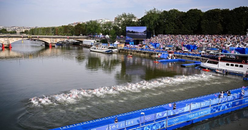 Athletes swim in the Seine during the men's individual triathlon race at the Paris 2024 Olympic Games on Wednesday.