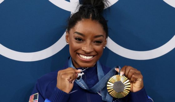 Gold medalist Simone Biles of Team United States poses with her gold medal Artistic Gymnastics Women's All-Around Final medal ceremony at the 2024 Paris Olympics on Thursday.