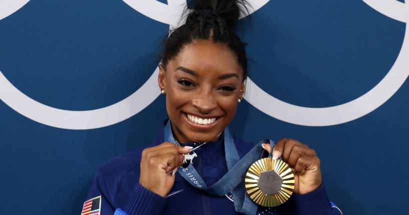 Gold medalist Simone Biles of Team United States poses with her gold medal Artistic Gymnastics Women's All-Around Final medal ceremony at the 2024 Paris Olympics on Thursday.