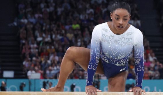 Simone Biles looks dejected and disappointed after her fall during the Women's Balance Beam Final at the Paris Olympic Games on Monday.