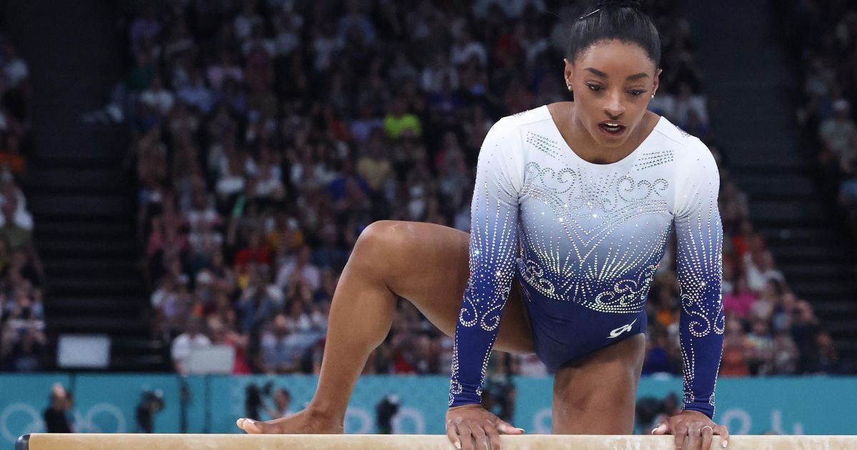 Simone Biles looks dejected and disappointed after her fall during the Women's Balance Beam Final at the Paris Olympic Games on Monday.