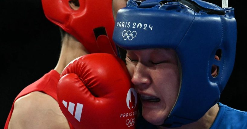 Uzbekistan's Sitora Turdibekova, right, is hit by Taiwan's Lin Yu-ting, left, during the women's 57kg preliminaries round of 16 boxing match during the Paris 2024 Olympic Games in Villepinte, France, on Friday.