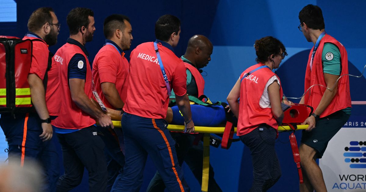 Terrifying Scene Unfolds at Olympic Pool as Swimmer Collapses, Is Removed on Stretcher