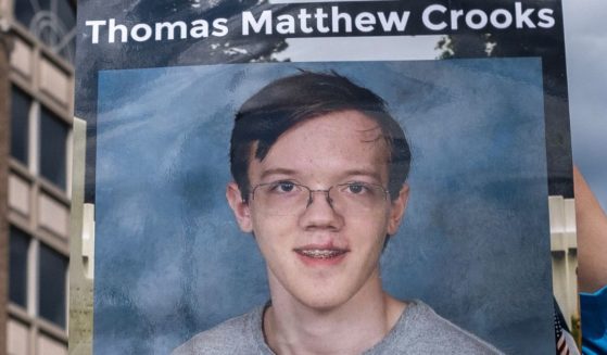 A picture of Thomas Matthew Crooks is held up in Milwaukee, Wisconsin, on July 17.