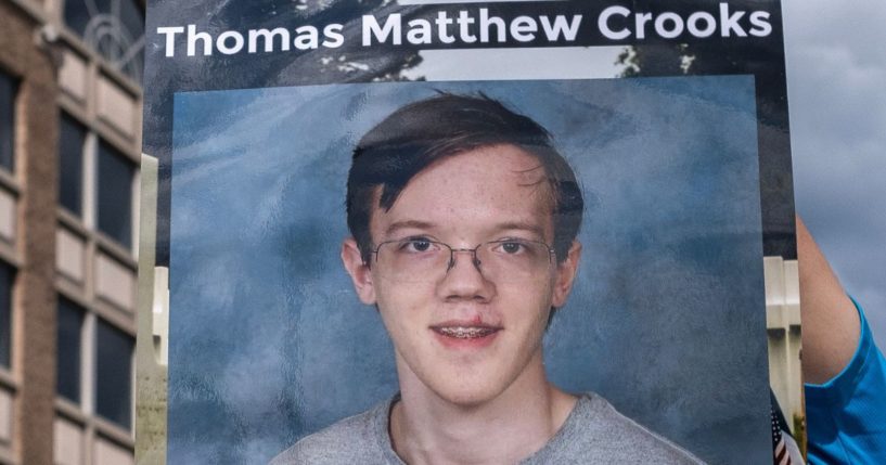 A picture of Thomas Matthew Crooks is held up in Milwaukee, Wisconsin, on July 17.