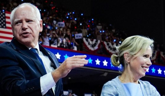 Minnesota Gov. Tim Walz and his wife Gwen Walz appear at a campaign rally in Philadelphia Tuesday after Tim Walz was announced as Kamala Harris' running mate in the 2024 presidential election.