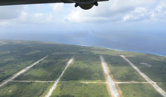 A U.S. Air Force C-130H Hercules flies over North Field, Tinian, Commonwealth of the Northern Mariana Islands.