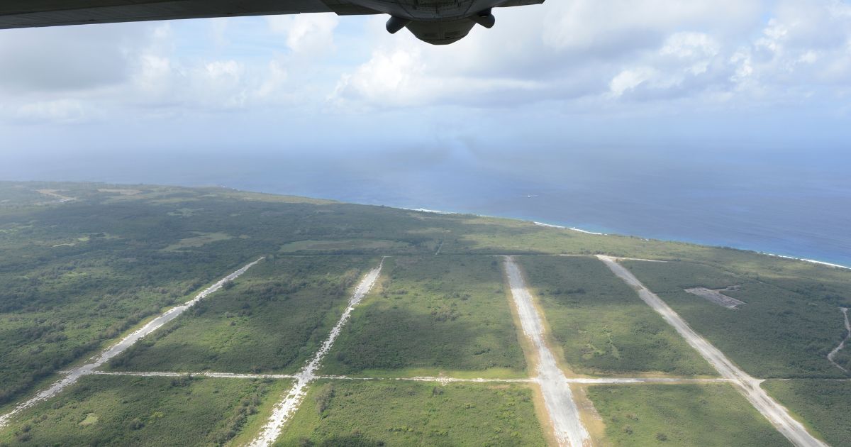 A U.S. Air Force C-130H Hercules flies over North Field, Tinian, Commonwealth of the Northern Mariana Islands.