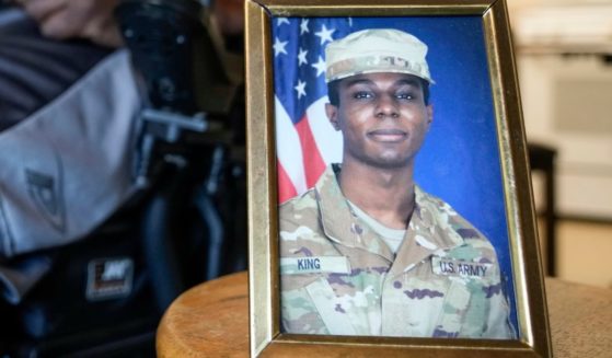 A portrait of U.S. Army Pvt. Travis King is displayed as his grandfather, Carl Gates, talks about his grandson on July 19, 2023, in Kenosha, Wisconsin.