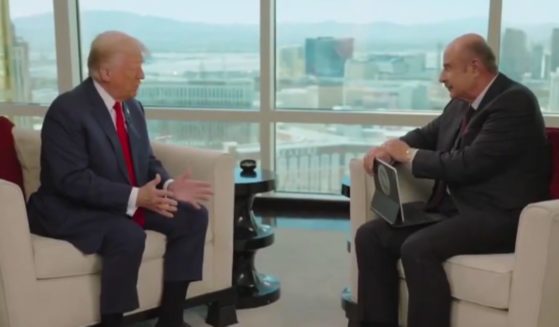 In an interview published on Tuesday, Dr. Phil, right, asked former President Donald Trump, left, why he thought he was spared from an assassin's bullet on July 13.