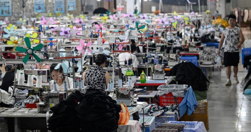 This photo taken on June 11, 2024 shows workers producing garments at a textile factory that supplies clothes to fast fashion e-commerce company Shein in Guangzhou in southern China's Guangdong province.