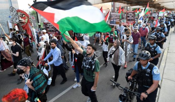 Pro-Palestinian activists march during a demonstration on the third day of the Democratic National Convention at the United Center in Chicago, Illinois on Wednesday. Vice President Kamala Harris will formally accept the party's nomination for president at the DNC which runs from August 19-22 in Chicago.