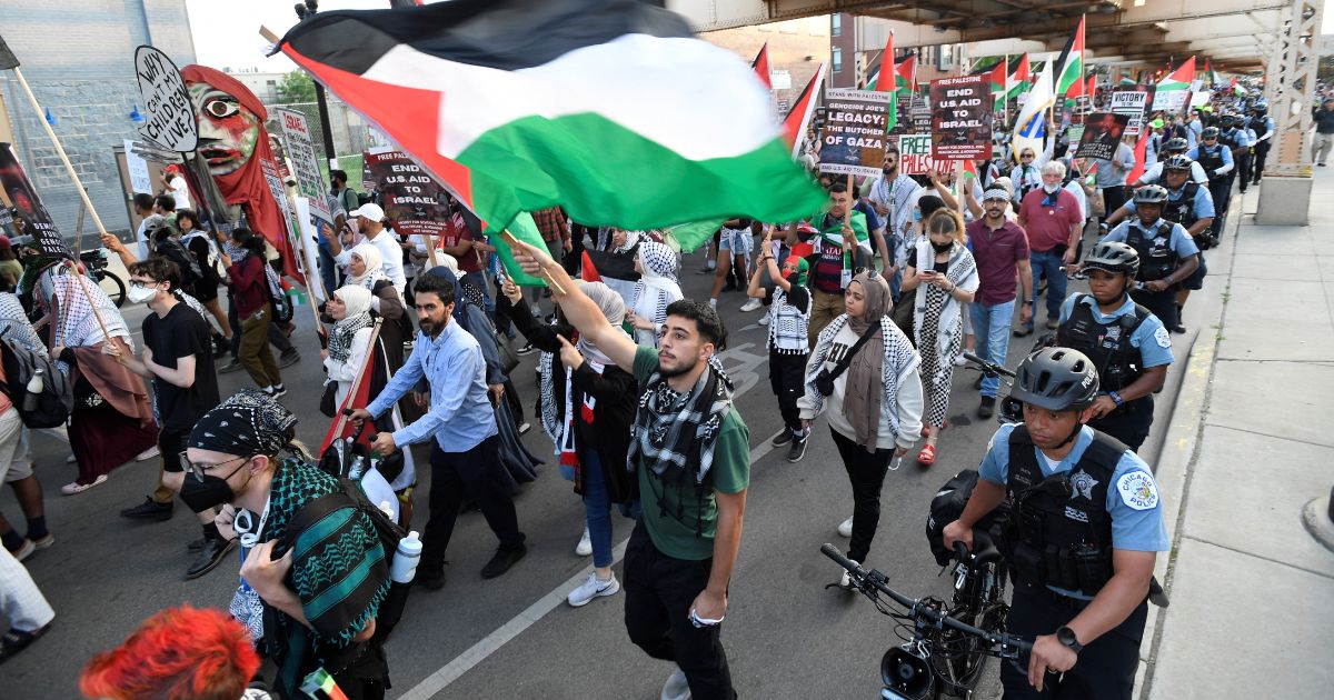 Pro-Palestinian activists march during a demonstration on the third day of the Democratic National Convention at the United Center in Chicago, Illinois on Wednesday. Vice President Kamala Harris will formally accept the party's nomination for president at the DNC which runs from August 19-22 in Chicago.