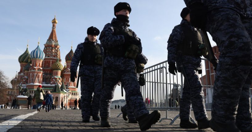 (RUSSIA OUT) Russian National Guard Service officers walk past to the Saint Basile's Cathedral at the Red Square on February 28, 2024 in Moscow, Russia. This week marks two years since Russia's large-scale invasion of Ukraine.