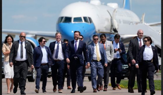 Republican vice presidential nominee Sen. J.D. Vance of Ohio walks back from looking at Air Force Two at Chippewa Valley Regional Airport, Wednesday in Eau Claire, Wisconsin.