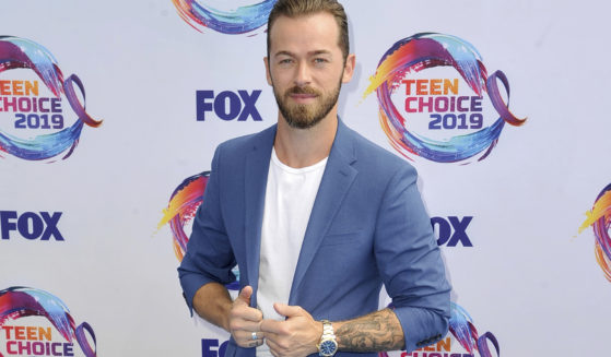 Artem Chigvintsev arrives at the Teen Choice Awards in Hermosa Beach, California, on Aug. 11, 2019.