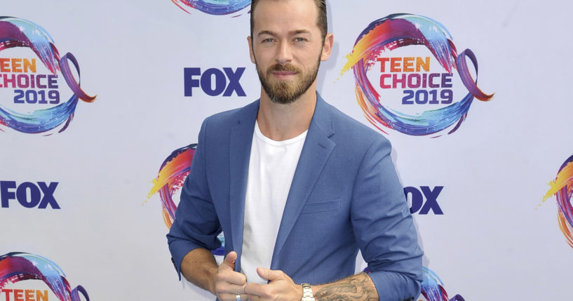 Artem Chigvintsev arrives at the Teen Choice Awards in Hermosa Beach, California, on Aug. 11, 2019.