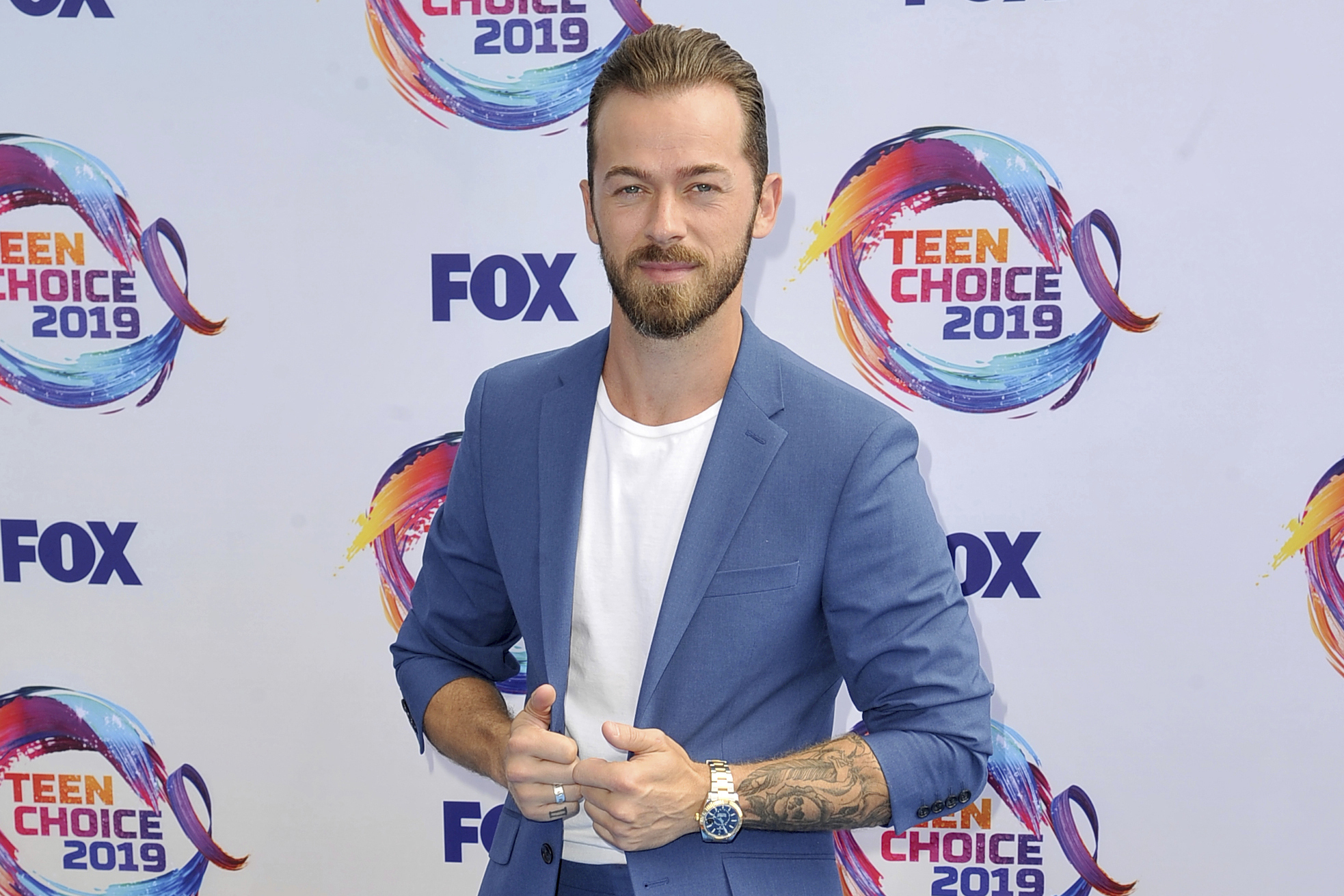 Artem Chigvintsev arrives at the Teen Choice Awards in Hermosa Beach, California, on Aug. 11, 2019.