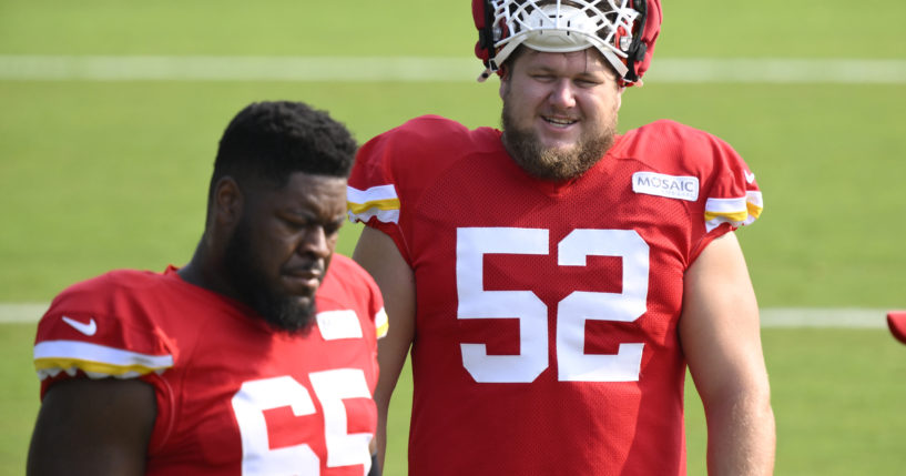 Kansas City Chiefs center Creed Humphrey (52) talks to Chiefs guard Trey Smith (65) during NFL football training camp Friday, July 26, 2024, in St. Joseph, Missouri.