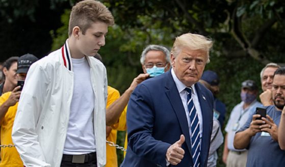 Then-President Donald Trump and son Barron are pictured in a file photo from August 2020 arriving at the White House.