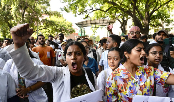 Doctors and paramedics protest against the rape and killing of a trainee doctor in Kolkata at a government hospital last week, as they gather in front of the Indian health minister's office, in New Delhi, India, on Friday.