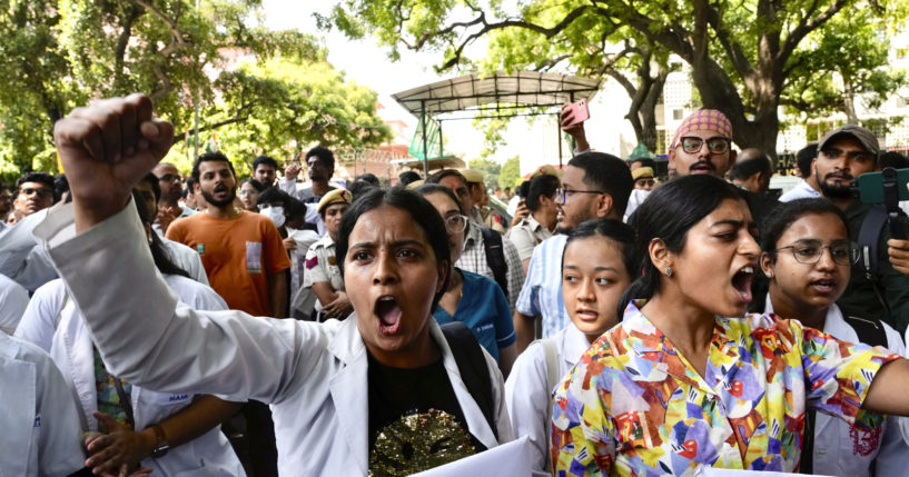 Doctors and paramedics protest against the rape and killing of a trainee doctor in Kolkata at a government hospital last week, as they gather in front of the Indian health minister's office, in New Delhi, India, on Friday.