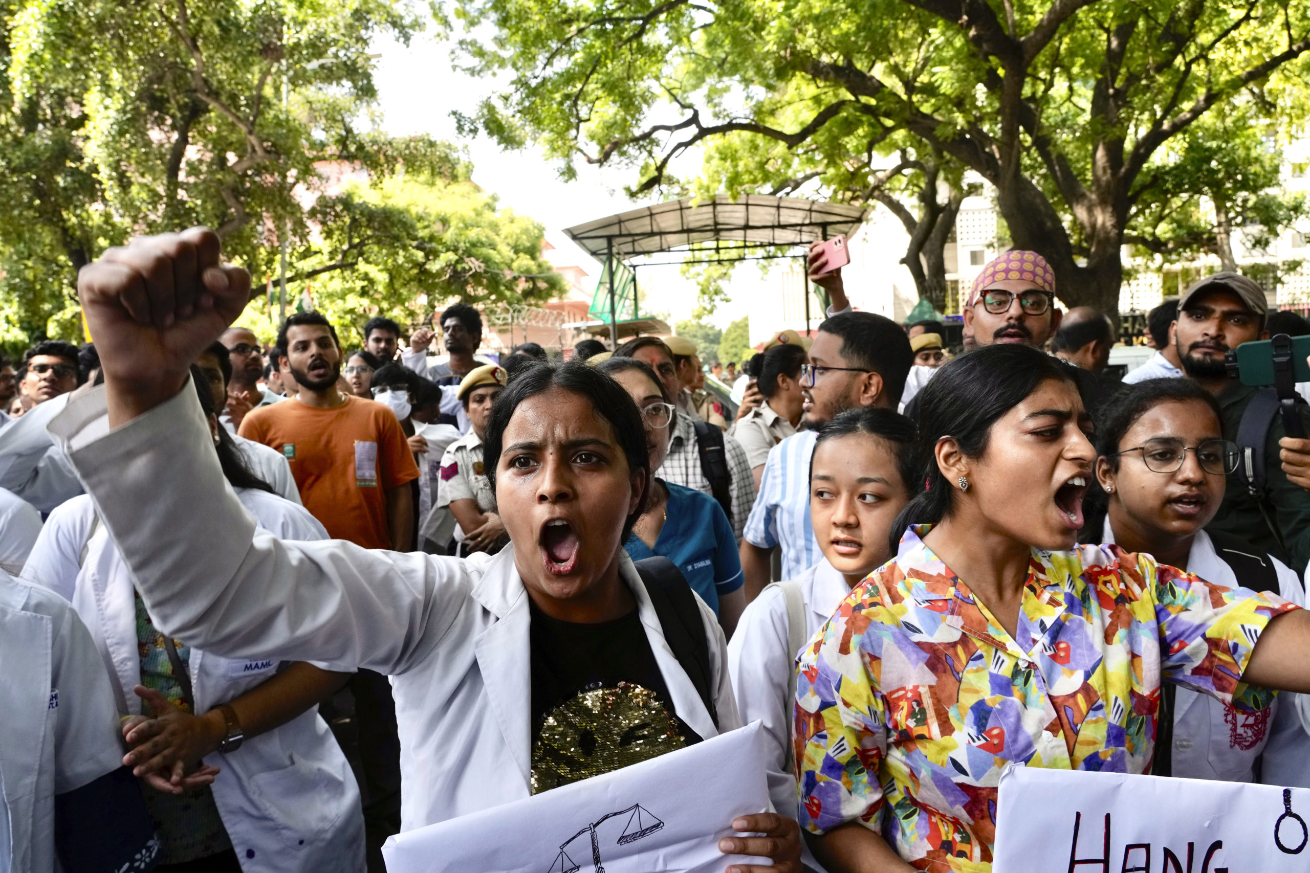 Doctors and paramedics protest against the rape and killing of a trainee doctor in Kolkata at a government hospital last week, as they gather in front of the Indian health minister's office, in New Delhi, India, on Friday.