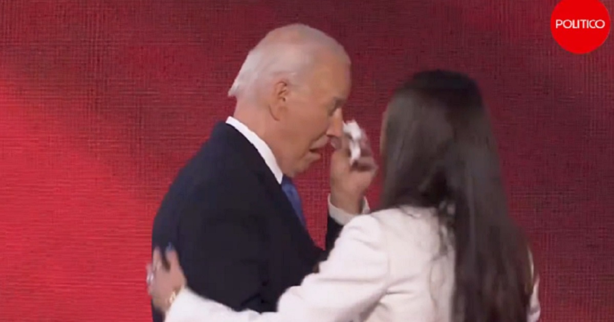 President Joe Biden uses a hankerchief to wipe away tears Monday night before addressing the Democratic National Convention.