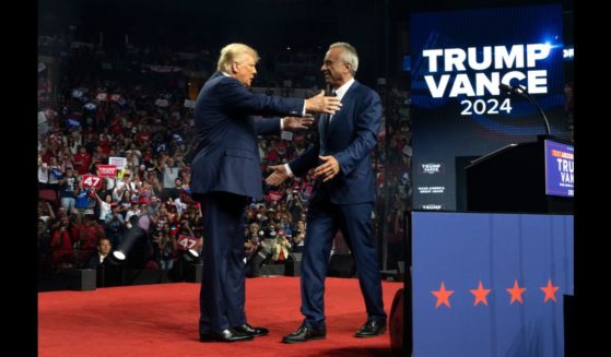 Republican presidential nominee, former U.S. President Donald Trump (L) embraces former presidential candidate Robert F. Kennedy Jr. during a campaign rally at Desert Diamond Arena on August 23, 2024 in Glendale, Arizona.