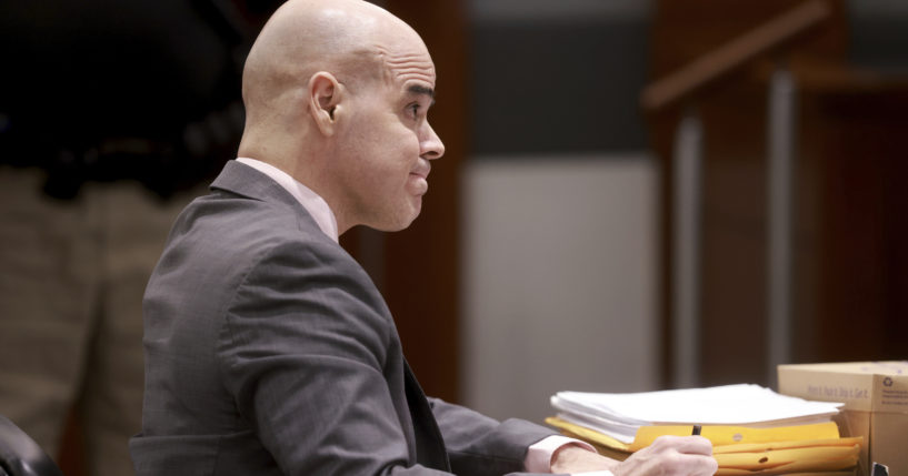 Robert Telles, a former Clark County public administrator charged in the murder of Las Vegas Review-Journal investigative journalist Jeff German, takes notes while listening to testimony during his murder trial at the Regional Justice Center in Las Vegas on Friday.