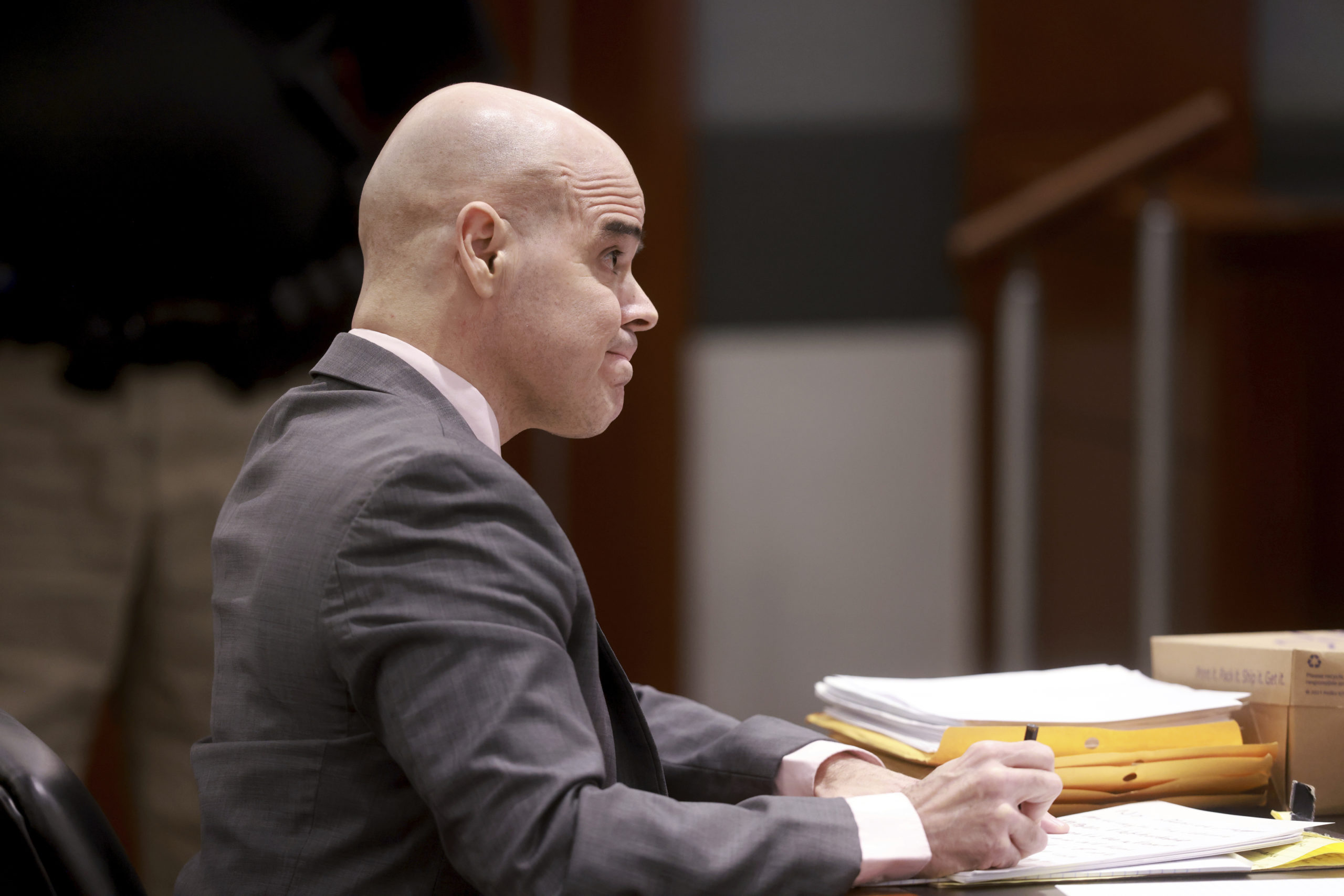 Robert Telles, a former Clark County public administrator charged in the murder of Las Vegas Review-Journal investigative journalist Jeff German, takes notes while listening to testimony during his murder trial at the Regional Justice Center in Las Vegas on Friday.