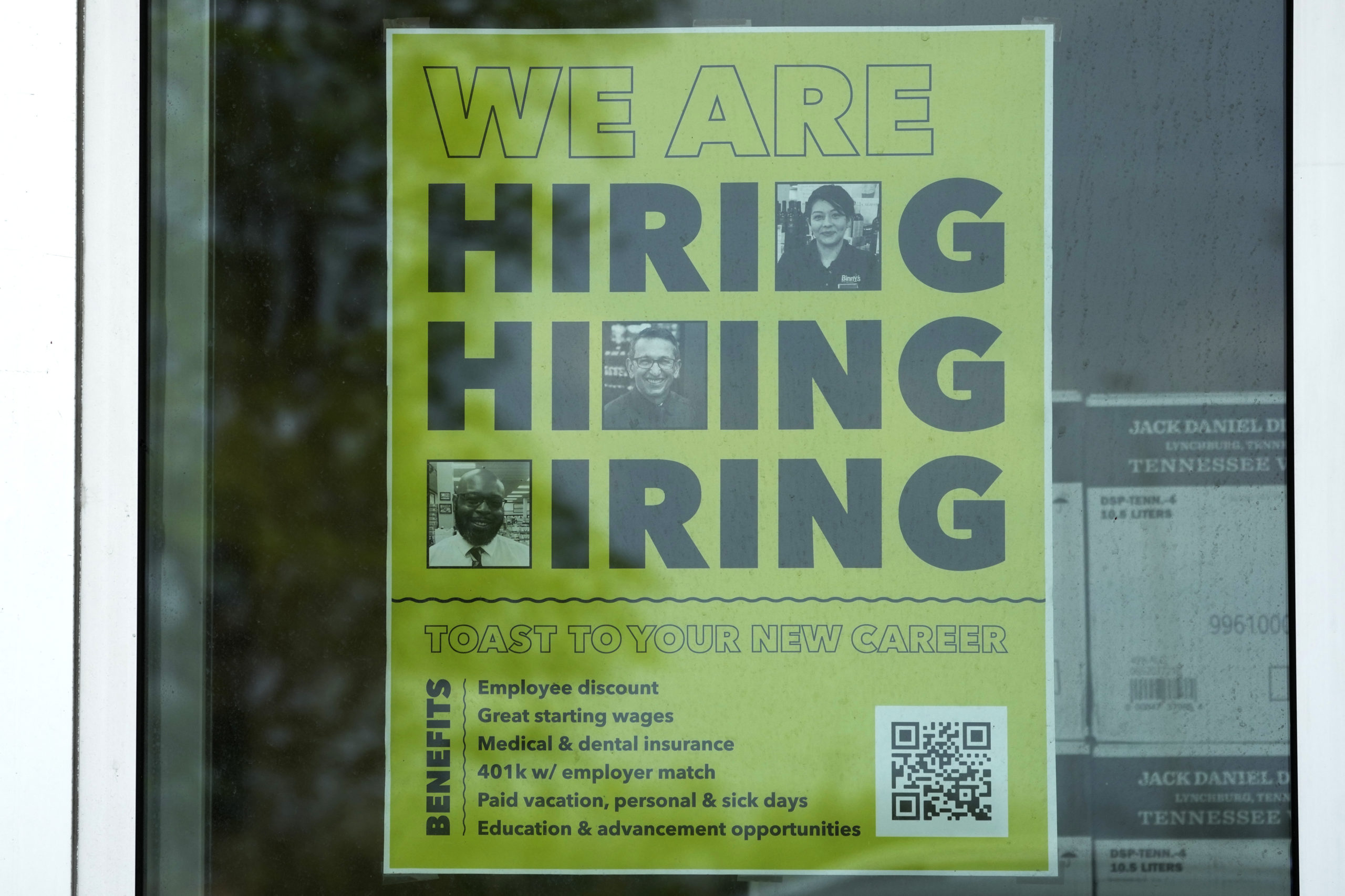 A hiring sign is displayed at a liquor store in Arlington Heights, Illinois on May 21, 2024.