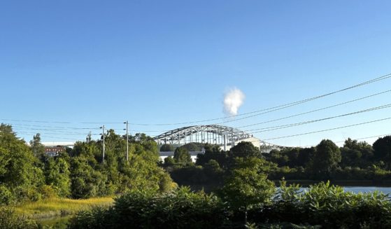 The Piscataqua River Bridge is shown in Portsmouth, New Hampshire., after a man connected to a homicide was fatally shot by police and an 8-year-old child was found shot to death in the man’s car on the bridge that connects New Hampshire to Maine on Thursday. An 8-year-old child was found shot to death in the man's car, the attorney general's office said Thursday.