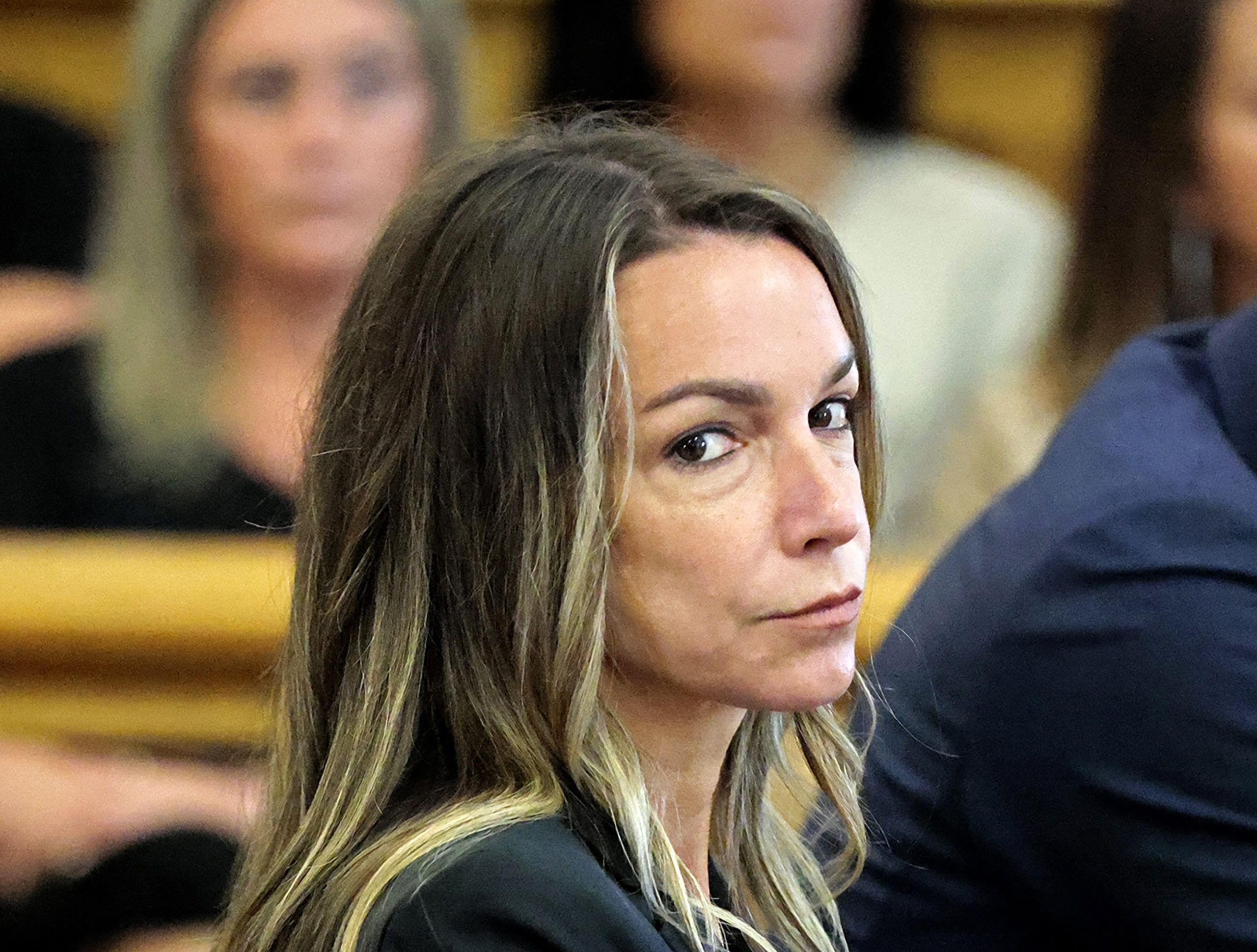 Karen Read looks toward the jurors, as they are greeted by Judge Beverly J. Cannone during her trial at Norfolk Superior Court in Dedham, Massachusetts, Monday, July 1, 2024.