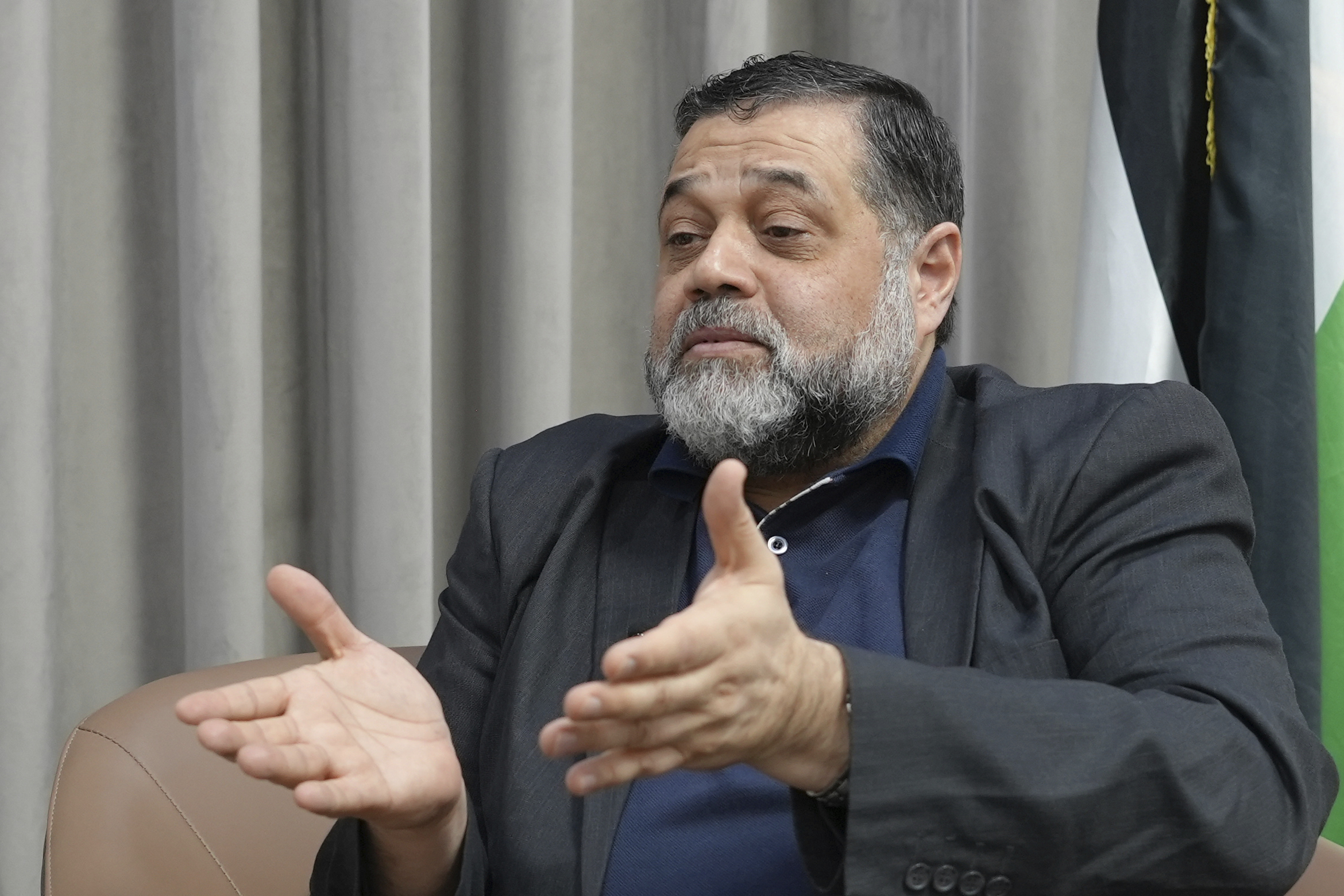 Hamas political official Osama Hamdan speaks during an interview with The Associated Press in Doha, Qatar, on Tuesday.